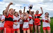 22 May 2022; Derry captain Brannagh Brolly lifts the cup alongside her teammates after the 2022 All-Ireland U14 Bronze Final between Derry and Offaly at the GAA National Games Development Centre in Abbotstown, Dublin. Photo by Ben McShane/Sportsfile