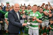 22 May 2022; Villa captain Adam Heaslip is presented with the cup by FAI president Gerry McAnaney after the FAI Centenary Junior Cup Final 2021/2022 match between Villa FC, Waterford, and Pike Rovers FC, Limerick, at Turner's Cross in Cork. Photo by Eóin Noonan/Sportsfile