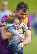 22 May 2022; Ben Brosnan of Wexford meets his son Benji after the Tailteann Cup Preliminary Round match between Wexford and Offaly at Bellefield in Enniscorthy, Wexford. Photo by Brendan Moran/Sportsfile