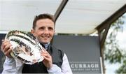 22 May 2022; Winning jockey Chris Hayes celebrates with the shield after riding Homeless Songs to win the Tattersalls Irish 1,000 Guineas during the Tattersalls Irish Guineas Festival at The Curragh Racecourse in Kildare. Photo by Harry Murphy/Sportsfile