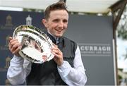 22 May 2022; Winning jockey Chris Hayes celebrates with the shield after riding Homeless Songs to win the Tattersalls Irish 1,000 Guineas during the Tattersalls Irish Guineas Festival at The Curragh Racecourse in Kildare. Photo by Harry Murphy/Sportsfile