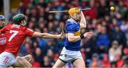 22 May 2022; Jake Morris of Tipperary scores his side's first goal under pressure from Mark Coleman of Cork during the Munster GAA Hurling Senior Championship Round 5 match between Tipperary and Cork at FBD Semple Stadium in Thurles, Tipperary. Photo by Piaras Ó Mídheach/Sportsfile