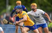 22 May 2022; Rory Hayes of Clare prepares to clear under pressure from Jack Prendergast of Waterford during the Munster GAA Hurling Senior Championship Round 5 match between Clare and Waterford at Cusack Park in Ennis, Clare. Photo by Ray McManus/Sportsfile