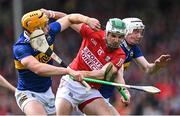 22 May 2022; Shane Kingston of Cork is tackled by Tipperary players Ronan Maher, left, and Séamus Kennedy during the Munster GAA Hurling Senior Championship Round 5 match between Tipperary and Cork at FBD Semple Stadium in Thurles, Tipperary. Photo by Piaras Ó Mídheach/Sportsfile