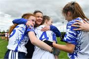 22 May 2022; Waterford manager Fiona Crotty celebrates with her players Niamh McGrath, left, and Ellie Gillane after the 2022 All-Ireland U14 Silver Final between Tyrone and Waterford at the GAA National Games Development Centre in Abbotstown, Dublin. Photo by Ben McShane/Sportsfile