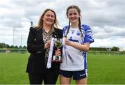 22 May 2022; Waterford captain Ruby Browne is presented the cup by Leinster LGFA president and LFGA Vice-president Trina Murray after the 2022 All-Ireland U14 Silver Final between Tyrone and Waterford at the GAA National Games Development Centre in Abbotstown, Dublin. Photo by Ben McShane/Sportsfile