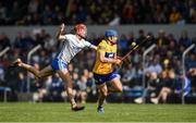 22 May 2022; Shane O'Donnell of Clare is tackled by Calum Lyons of Waterford during the Munster GAA Hurling Senior Championship Round 5 match between Clare and Waterford at Cusack Park in Ennis, Clare. Photo by Ray McManus/Sportsfile