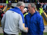 22 May 2022; The two managers, Brian Lohan and Liam Cahill, shake hands after the Munster GAA Hurling Senior Championship Round 5 match between Clare and Waterford at Cusack Park in Ennis, Clare. Photo by Ray McManus/Sportsfile