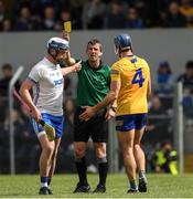 22 May 2022; Referee Paud O'Dwyer issues a yellow card to both Stephen Bennett of Waterford and Cian Nolan of Clare during the Munster GAA Hurling Senior Championship Round 5 match between Clare and Waterford at Cusack Park in Ennis, Clare. Photo by Ray McManus/Sportsfile