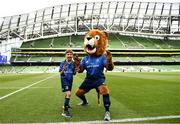 21 May 2022; Leinster mascot Alex Traynor with Leo the Lion before the United Rugby Championship match between Leinster and Munster at the Aviva Stadium in Dublin. Photo by Harry Murphy/Sportsfile