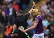 21 May 2022; Damien Reck of Wexford is shown a yellow card by referee Fergal Horgan during the Leinster GAA Hurling Senior Championship Round 5 match between Kilkenny and Wexford at UPMC Nowlan Park in Kilkenny. Photo by Stephen McCarthy/Sportsfile