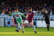 23 May 2022; Mandroiu of Shamrock Rovers has a shot on goal despite the attention of Gary Deegan of Drogheda United during the SSE Airtricity League Premier Division match between Drogheda United and Shamrock Rovers at Head in the Game Park in Drogheda, Louth. Photo by Ben McShane/Sportsfile