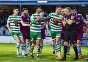 23 May 2022; Danny Mandroiu of Shamrock Rovers is restrained by teammate Lee Grace, right, as referee Ray Matthews makes his way to consult a decision with the linesman, resulting in a red card, during the SSE Airtricity League Premier Division match between Drogheda United and Shamrock Rovers at Head in the Game Park in Drogheda, Louth. Photo by Ben McShane/Sportsfile
