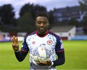 23 May 2022; Tunde Owolabi of St Patrick's Athletic with the match ball after scoring a hat-trick in the SSE Airtricity League Premier Division match between St Patrick's Athletic and Bohemians at Richmond Park in Dublin. Photo by Piaras Ó Mídheach/Sportsfile