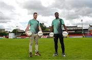 24 May 2022; In attendance at the Football for Unity festival launch at Richmond Park in Dublin are NEIC Community Sport & Wellness co-ordinator and former Dublin football Michael Darragh Macauley, left, and St Patrick's Athletic player James Abankwah. The six weeks long festival, organised by SARI and Dublin NEIC, will once again showcase the potential of football as an educational tool which can bring communities together and promote social inclusion for newcomers to Ireland. Photo by Ramsey Cardy/Sportsfile