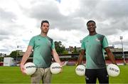 24 May 2022; In attendance at the Football for Unity festival launch at Richmond Park in Dublin are NEIC Community Sport & Wellness co-ordinator and former Dublin football Michael Darragh Macauley, left, and St Patrick's Athletic player James Abankwah. The six weeks long festival, organised by SARI and Dublin NEIC, will once again showcase the potential of football as an educational tool which can bring communities together and promote social inclusion for newcomers to Ireland. Photo by Ramsey Cardy/Sportsfile