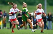 22 May 2022; Anna Dempsey of Offaly in action against Brooke Harbinson, left, and Caitlin McGuckin of Derry during the 2022 All-Ireland U14 Bronze Final between Derry and Offaly at the GAA National Games Development Centre in Abbotstown, Dublin. Photo by Ben McShane/Sportsfile