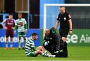 23 May 2022; Jack Byrne of Shamrock Rovers is treated for an injury by Shamrock Rovers physiotherapist Tony McCarthy during the SSE Airtricity League Premier Division match between Drogheda United and Shamrock Rovers at Head in the Game Park in Drogheda, Louth. Photo by Ben McShane/Sportsfile