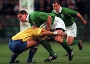 21 November 1998: Andy Ward of Ireland is tackled by Roland Vusec of Romania during the World Cup Qualifing match between Ireland and Romania at Lansdowne Road in Dublin. Photo by David Maher/Sportsfile