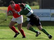 12 September 1998: Anthony Foley of Munster is tackled by Shane McEntee of Connacht during the Guinness Interprovincial Rugby Championship match between Munster and Connacht at Dooradoyle in Limerick. Photo by Matt Browne/Sportsfile