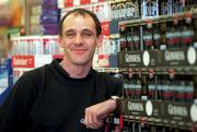 11 Decemeber 1998: David Beggy of Buccaneers stands for a portrait at a store display in Crazy Prices, Ballyfermot, Dublin. Photo by Brendan Moran/Sportsfile