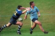 12 December 1998: David Blaney of UCD is tackled by Tim Allnutt of Corinthians during the AIB All Ireland League Division 3 match between UCD and Corinthians at Belfield in Dublin. Photo by Ray McManus/Sportsfile