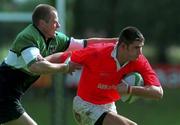 12 September 1998: Eddie Haley of Munster is tackled by Mervyn Murphy of Connacht during the Guinness Interprovincial Rugby Championship match between Munster and Connacht at Dooradoyle in Limerick. Photo by Matt Browne/Sportsfile