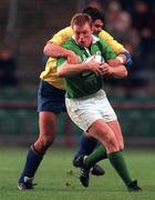 21 November 1998: Eric Miller of Ireland is tackled by Florin Corodeanu of Romania during the World Cup Qualifing match between Ireland and Romania at Lansdowne Road in Dublin. Photo by David Maher/Sportsfile