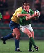 21 November 1998: Eric Miller of Ireland is tackled by Florin Corodeanu of Romania during the World Cup Qualifing match between Ireland and Romania at Lansdowne Road in Dublin. Photo by David Maher/Sportsfile