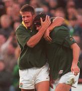21 November 1998: Johan Erasmus of South Africa is congratulated by team-mate Bobby Skinstad, left, after scoring their side's first try during the World Cup Qualifing match between Ireland and Romania at Lansdowne Road in Dublin. Photo by David Maher/Sportsfile