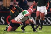 28 November 1998; Keith Wood of Ireland goes over to score Ireland's first try despite the efforts of Johan Erasmus of South Africa during a International Friendly Match between Ireland and South Africa at Landsdowne Road in Dublin. Photo by Brendan Moran/Sportsfile