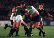 28 November 1998; Victor Costello of Ireland is tackled by Bobby Skinstad, 7, and Stefan Terblanche of South Africa during a International Friendly Match between Ireland and South Africa at Landsdowne Road in Dublin. Photo by Brendan Moran/Sportsfile