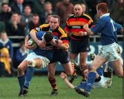 12 December 1998: Kelvin McNamee of St. Mary's College is tackled by Brian Glennon of Lansdowne during the AIB All Ireland league division 1 match between St Mary's College v Lansdowne at Templeville Road in Dublin. Photo by Brendan Moran/Sportsfile