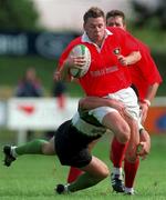 12 September 1998: Killian Keane of Munster is tackled by Simon Allnutt of Connacht during the Guinness Interprovincial Rugby Championship match between Munster and Connacht at Dooradoyle in Limerick. Photo by Matt Browne/Sportsfile