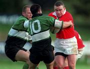 12 September 1998: Michael Lynch of Munster is tackled by Simon Allnutt, 10, and Mervyn Murphy of Connacht  during the Guinness Interprovincial Rugby Championship match between Munster and Connacht at Dooradoyle in Limerick. Photo by Matt Browne/Sportsfile