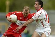 9 May 2004; Johnny McBride, Derry, in action against Joe McMahon, Tyrone. Bank of Ireland Ulster Senior Football Championship, Tyrone v Derry, St. Tighernach's Park, Clones, Co. Monaghan. Picture credit; Pat Murphy / SPORTSFILE