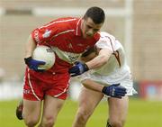 9 May 2004; Brendan Mullin, Derry, in action against Paul Marlowe, Tyrone. Ulster Minor Football Championship, Tyrone v Derry, St. Tighernach's Park, Clones, Co. Monaghan. Picture credit; Pat Murphy / SPORTSFILE