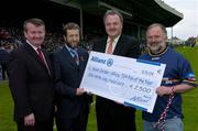 9 May 2004; Winner of the Allianz TG4 Fan of the Year competition, Kevin Jordan, right, a member of the Southern Gaels club, Athlone, is presented with his prize by from left, Pol O Gallchoir, TG4, GAA President Sean Kelly and Brendan Murphy, Chief Executive Allianz. Allianz Hurling League Final, Division 1, Galway v Waterford, Gaelic Grounds, Limerick. Picture credit; Ray McManus / SPORTSFILE