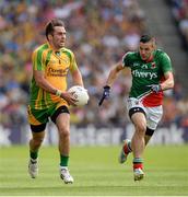 4 August 2013; Karl Lacey, Donegal, in action against Cathal Carolan, Mayo. GAA Football All-Ireland Senior Championship, Quarter-Final, Mayo v Donegal, Croke Park, Dublin. Picture credit: Ray McManus / SPORTSFILE