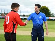 27 May 2022; George Dockrell of Leinster Lighting and PJ Moor of Munster Reds shake hands after the coin toss before the Cricket Ireland Inter-Provincial Trophy match between Leinster Lightning and Munster Reds at North Down Cricket Club, Comber in Down. Photo by George Tewkesbury/Sportsfile