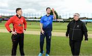 27 May 2022; George Dockrell of Leinster Lighting and PJ Moor of Munster Reds with Match referee Phil Thompson during the coin toss before the Cricket Ireland Inter-Provincial Trophy match between Leinster Lightning and Munster Reds at North Down Cricket Club, Comber in Down. Photo by George Tewkesbury/Sportsfile