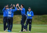 27 May 2022; Jack Carty of Leinster Lighting celebrates with his team mates as he takes an early wicket for his side during the Cricket Ireland Inter-Provincial Trophy match between Leinster Lightning and Munster Reds at North Down Cricket Club, Comber in Down. Photo by George Tewkesbury/Sportsfile