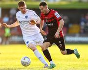 27 May 2022; Liam Burt of Bohemians in action against Darragh Nugent of Drogheda United during the SSE Airtricity League Premier Division match between Bohemians and Drogheda United at Dalymount Park in Dublin. Photo by Michael P Ryan/Sportsfile