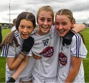 21 May 2022; Emily Conlan, left, the Kildare captain Katie Ray and Aoibheann Mahon, right, celebrate after the Ladies Football U14 All-Ireland Gold Final match between Kildare and Tipperary at Crettyard GAA in Laois. Photo by Ray McManus/Sportsfile