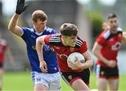 28 May 2022; Ruairi O'Hare of Down in action against Jason McLoughlin of Cavan during the Tailteann Cup Round 1 match between Cavan and Down at Kingspan Breffni in Cavan. Photo by Oliver McVeigh/Sportsfile