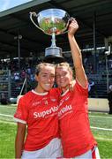 28 May 2022; Sisters Sarah Leahy, left, and Rachel Leahy of Cork celebrate with the cup after the TG4 Munster Senior Ladies Football Championship Final match between Kerry and Cork at Fitzgerald Stadium in Killarney. Photo by Diarmuid Greene/Sportsfile