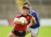 28 May 2022; Daniel McGuinness of Down in action against Gerard Smith of Cavan during the Tailteann Cup Round 1 match between Cavan and Down at Kingspan Breffni in Cavan. Photo by Oliver McVeigh/Sportsfile