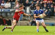 28 May 2022; James Smith of Cavan in action against Adam Lynch of Down during the Tailteann Cup Round 1 match between Cavan and Down at Kingspan Breffni in Cavan. Photo by Oliver McVeigh/Sportsfile
