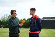 28 May 2022; Northern Knights captain Mark Adair with stream host Andrew Blare White after the coin toss before the Cricket Ireland Inter-Provincial Trophy match between Munster Reds and Northern Knights at North Down Cricket Club in Comber, Down. Photo by George Tewkesbury/Sportsfile