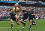28 May 2022; Dillyn Leyds of La Rochelle catches under pressure from Leinster players, from left, Hugo Keenan, Robbie Henshaw and James Lowe during the Heineken Champions Cup Final match between Leinster and La Rochelle at Stade Velodrome in Marseille, France. Photo by Ramsey Cardy/Sportsfile